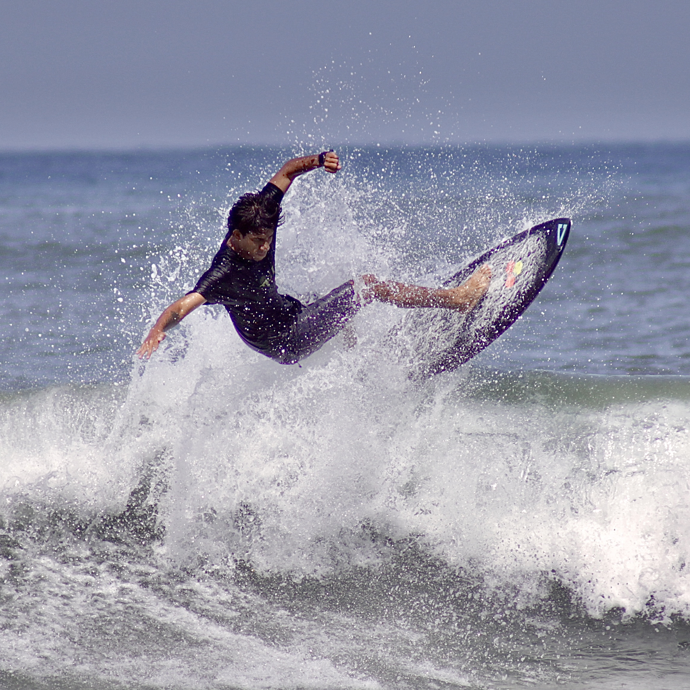 surfer cutting up the waves at playa guiones, Nosara Costa Rica