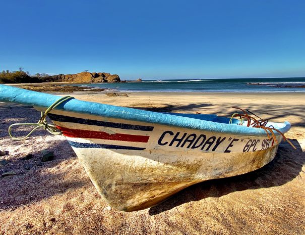 small fishing boat at play pelada, nosara, costa rica
