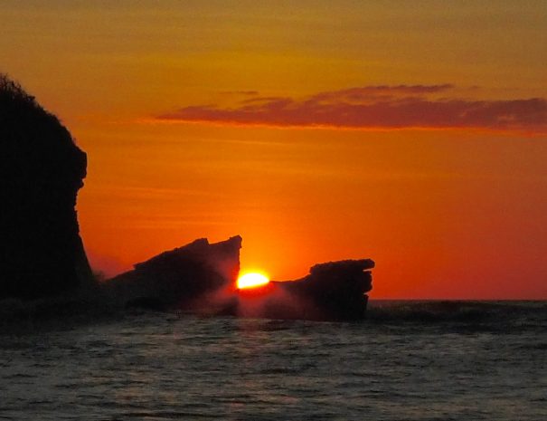 Sunset between the anvils at playa pelada, Nosara Costa Rica