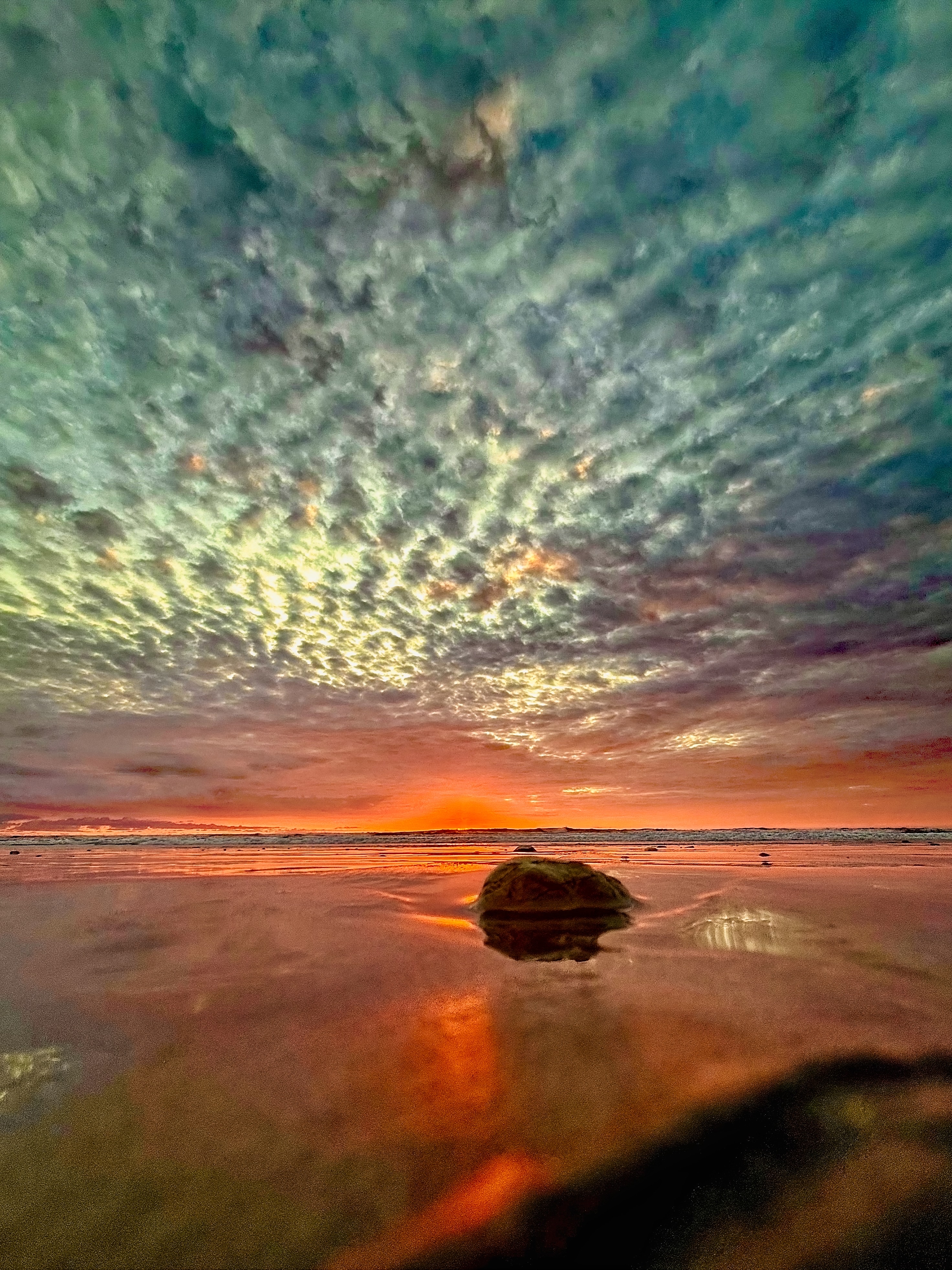 colorful popcorn sunset at playa guiones, nosara, costa rica