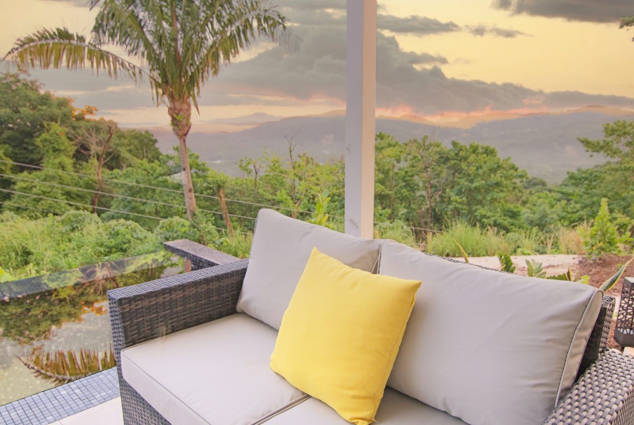 outdoor sitting area and infinity pool at villa 1, nosara, costa rica