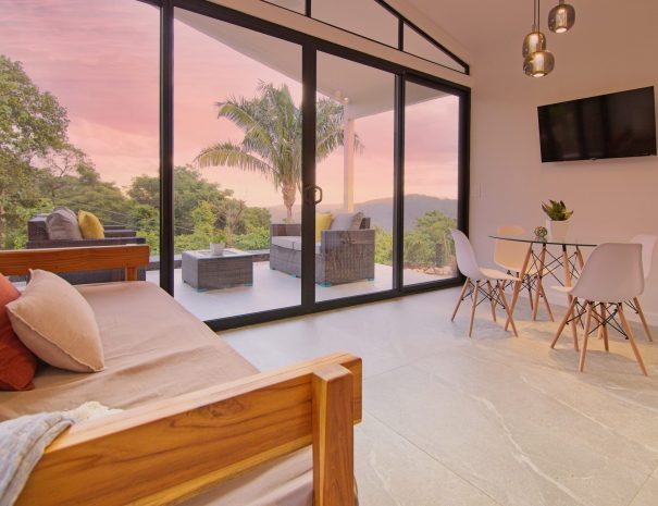 living area and flat screen TV with outdoor living area in Villa 1, nosara, costa rica