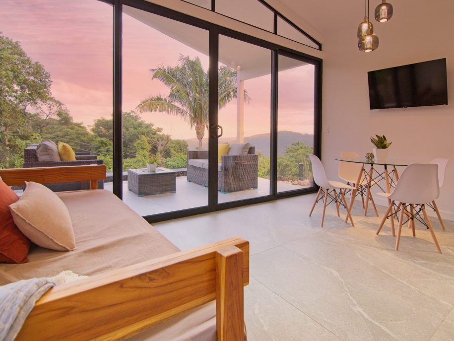 living area and flat screen TV with outdoor living area in Villa 1, nosara, costa rica