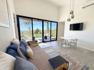 Villa Sueno kitchen2 - full stocked kitchen with dining table, day bed and TV